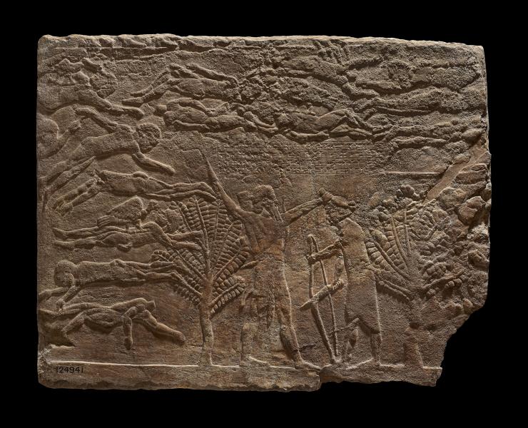 Plaster bas-relief of an Assyrian soldier preparing to behead an Elamite general named Ituni, 645-640 BC. AD, North Palace, Nineveh (Iraq). 1856,0909.38. © The Trustees of the British Museum